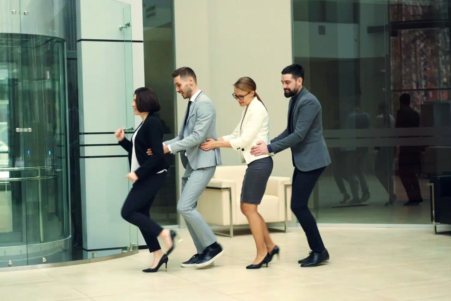 collegues doing the conga round the office