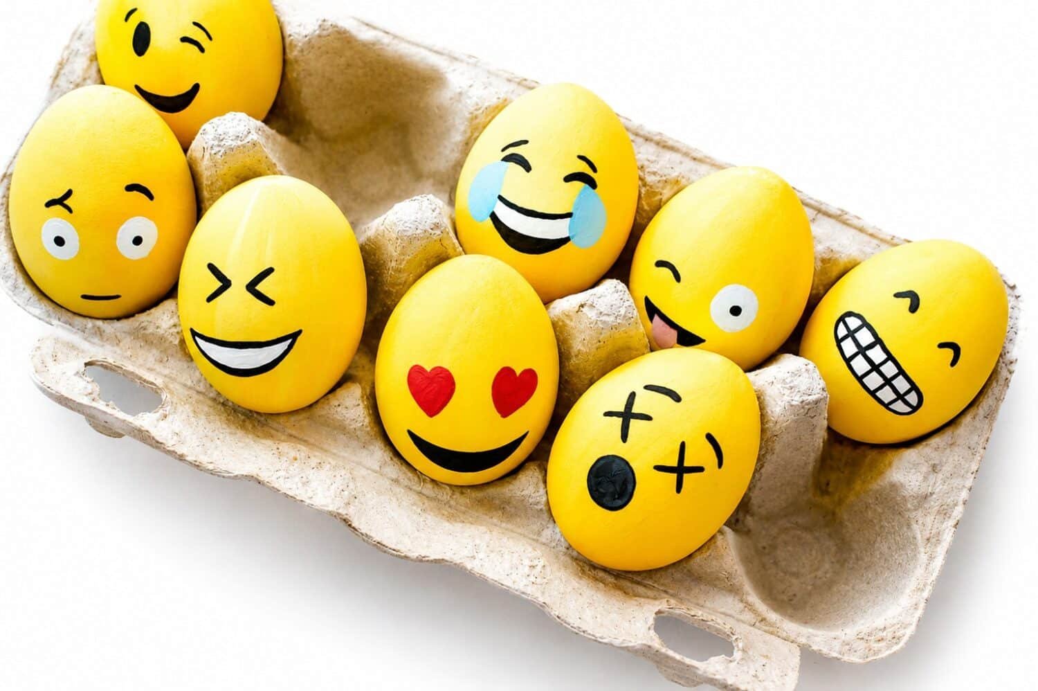 Egg emojis - eggs painted yellow showing different emotions