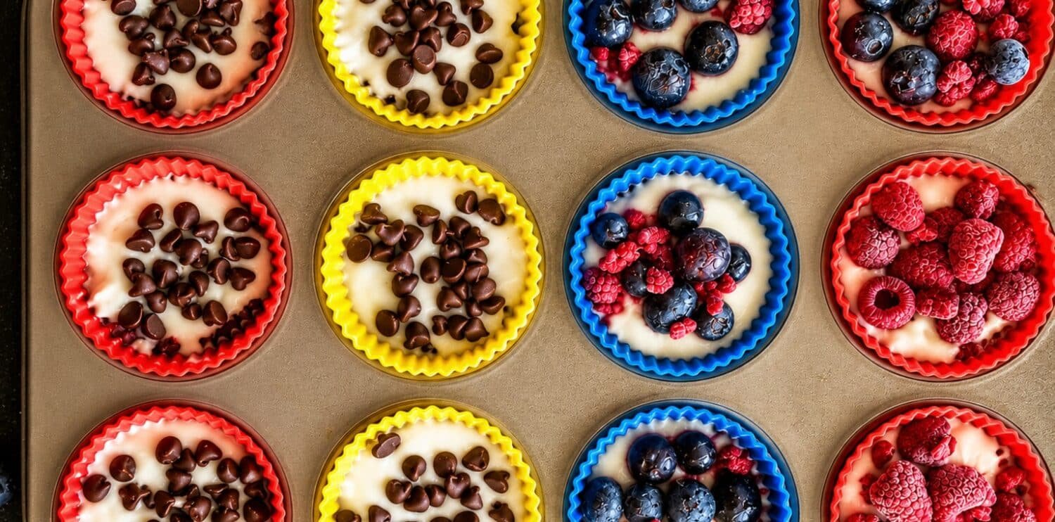 Frozen Greek yogurt oat cups with chocolate chips, blueberries and raspberries.